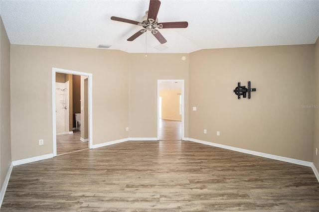 unfurnished room featuring ceiling fan, lofted ceiling, and wood-type flooring