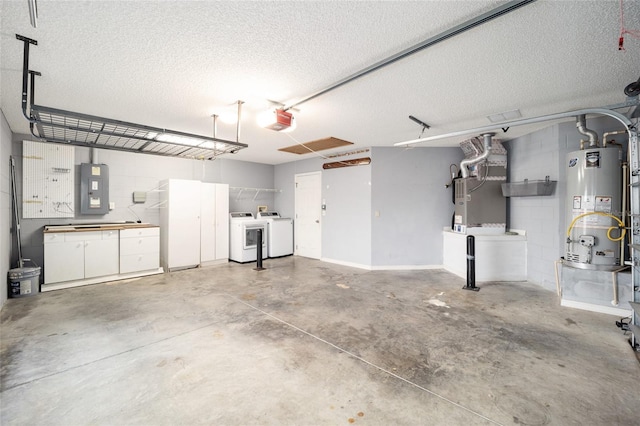 garage featuring a garage door opener, electric panel, heating unit, water heater, and washer and clothes dryer