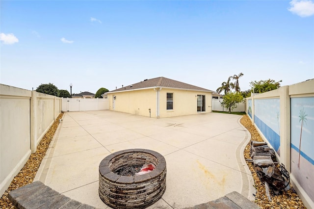 view of patio / terrace with a fire pit