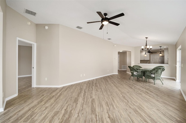 17159 SE 78th Crowfield Ave, The Villages, FL 32162 - interior space with arched walkways, ceiling fan with notable chandelier, vaulted ceiling, and visible vents