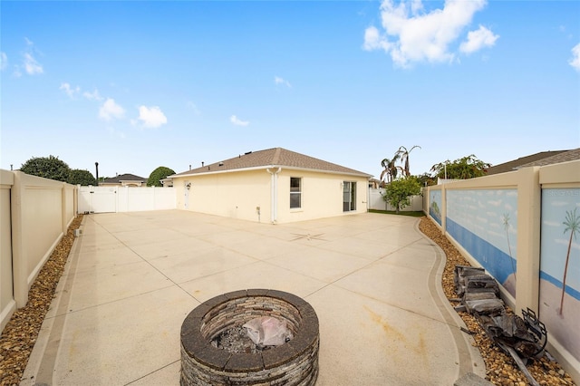 17159 SE 78th Crowfield Ave, The Villages, FL 32162 - view of patio / terrace featuring a fenced backyard and a fire pit