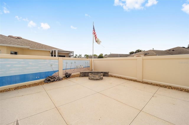 17159 SE 78th Crowfield Ave, The Villages, FL 32162 - view of patio featuring an outdoor fire pit and a fenced backyard
