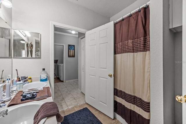 bathroom with tile patterned flooring, vanity, and crown molding