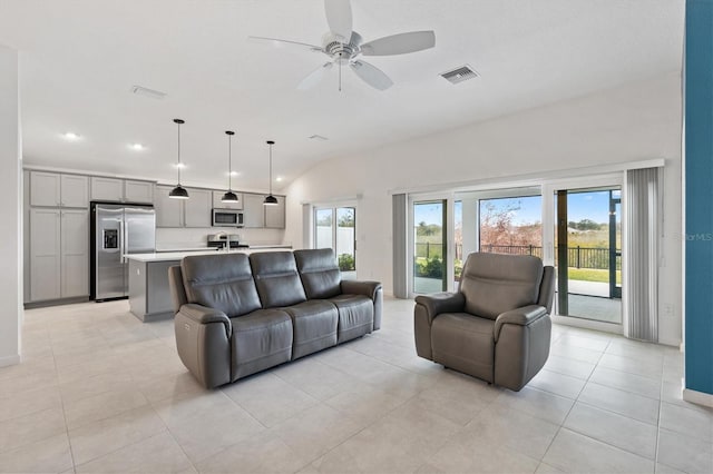 living room with light tile patterned floors and ceiling fan