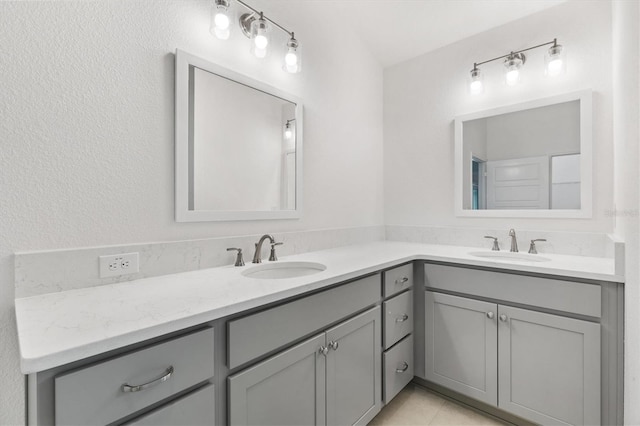 bathroom featuring tile patterned flooring and vanity