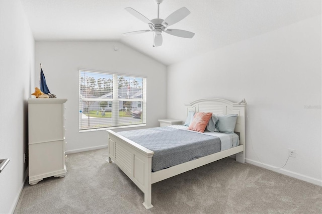 carpeted bedroom featuring ceiling fan and lofted ceiling