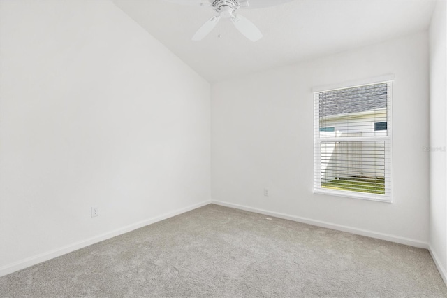 spare room with carpet flooring, ceiling fan, and lofted ceiling