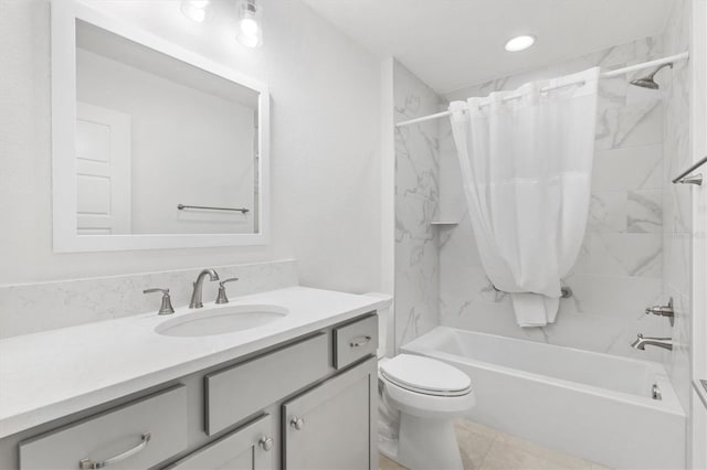 full bathroom featuring shower / bath combo with shower curtain, vanity, and toilet