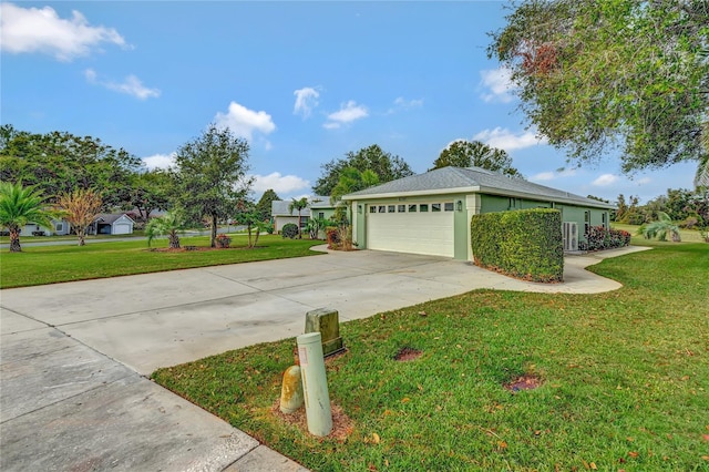 view of side of home featuring a lawn and a garage