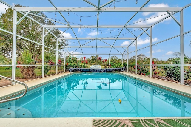 view of pool featuring a lanai