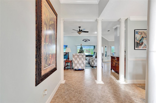 hallway featuring light tile patterned floors, crown molding, and ornate columns