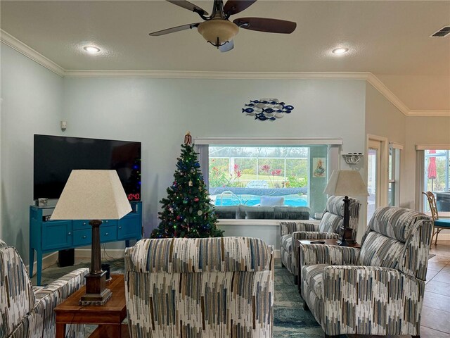 tiled living room with crown molding and ceiling fan