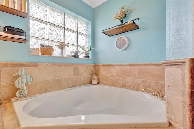 bathroom with a tub to relax in