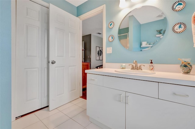 bathroom with vanity and tile patterned flooring