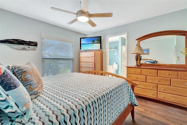 bedroom featuring ceiling fan, connected bathroom, and hardwood / wood-style floors