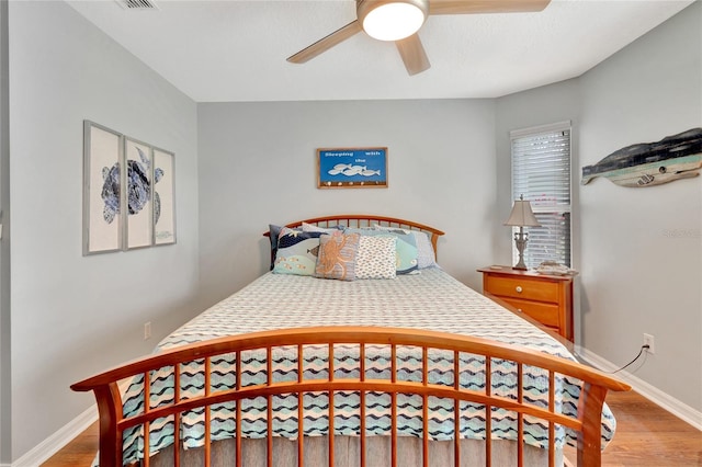 bedroom featuring ceiling fan and light wood-type flooring