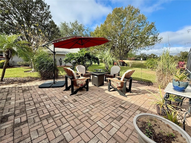 view of patio featuring an outdoor fire pit