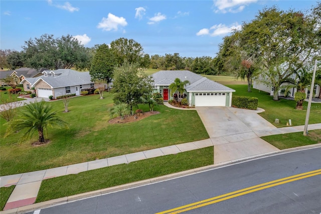 ranch-style home with a garage and a front yard