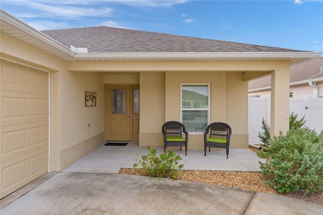 view of exterior entry with a garage