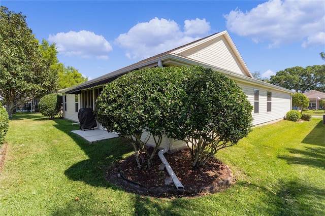 view of home's exterior featuring a yard