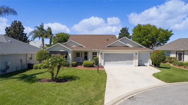 ranch-style house with central AC unit, a garage, and a front lawn