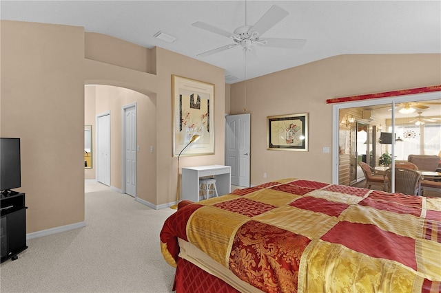 bedroom with vaulted ceiling, carpet, baseboards, ceiling fan, and arched walkways