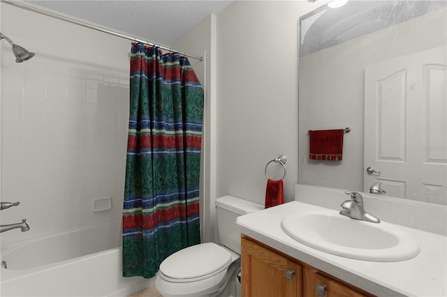 bathroom featuring toilet, shower / tub combo with curtain, vanity, and a textured ceiling