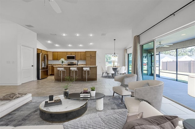 tiled living room with ceiling fan