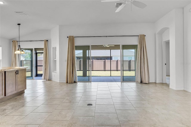 empty room with ceiling fan and light tile patterned flooring