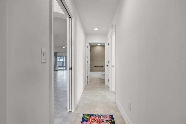 hallway featuring light tile patterned flooring