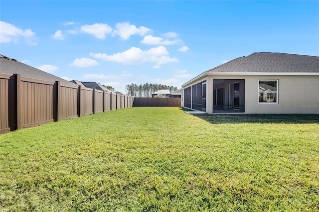 view of yard with a sunroom