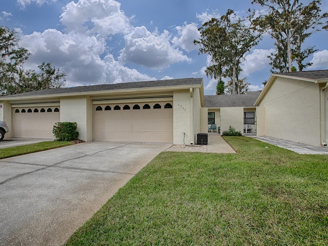 single story home with a front lawn and a garage