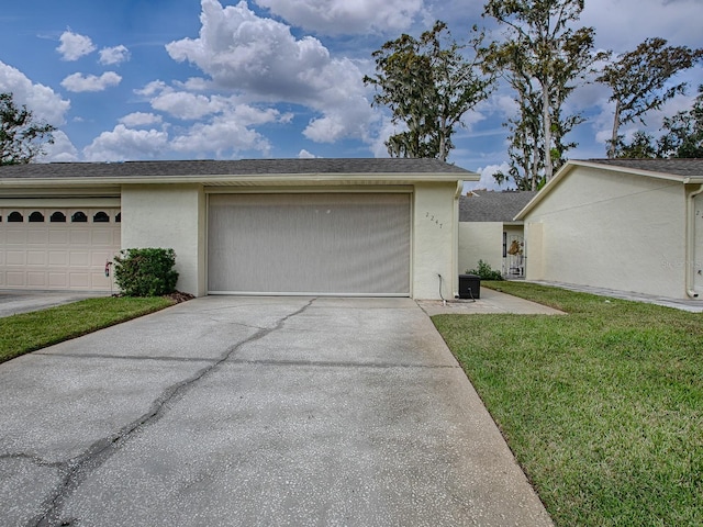 garage with a lawn