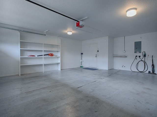 garage featuring a garage door opener and electric panel