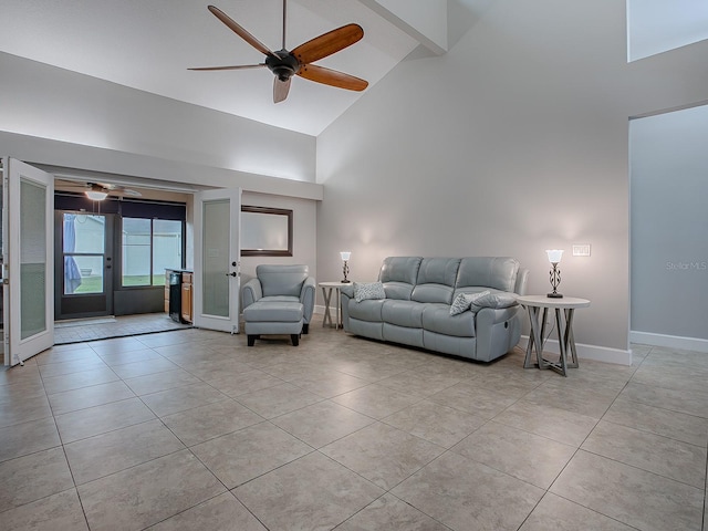 tiled living room with high vaulted ceiling and ceiling fan