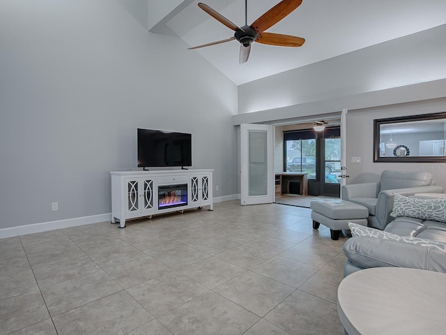 tiled living room featuring ceiling fan, french doors, and high vaulted ceiling