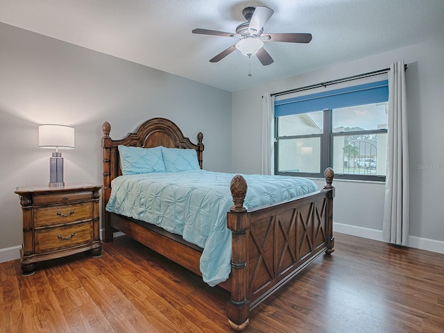 bedroom with hardwood / wood-style floors and ceiling fan