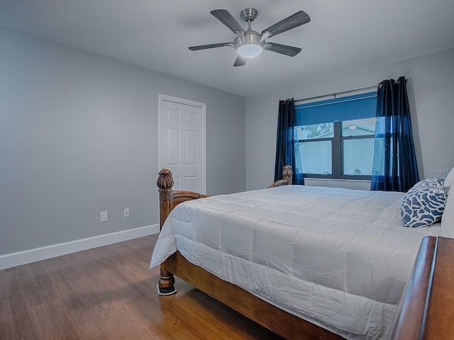 bedroom with ceiling fan and wood-type flooring