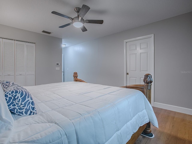 bedroom with a closet, ceiling fan, and hardwood / wood-style floors