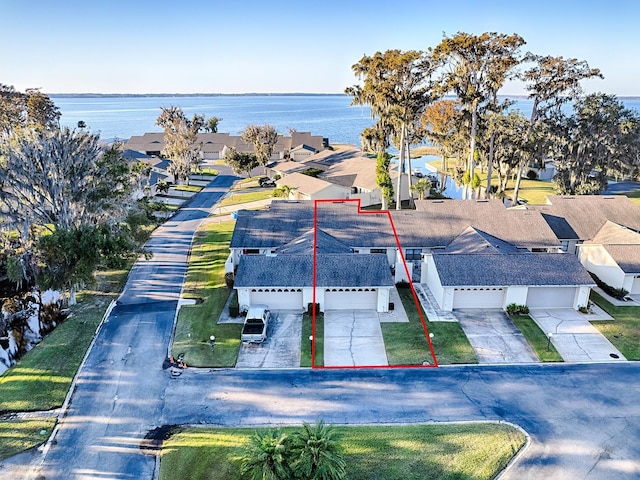 drone / aerial view with a water view