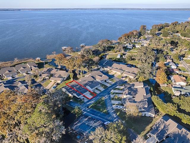 bird's eye view featuring a water view and a residential view