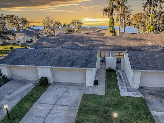 single story home with a yard and a garage