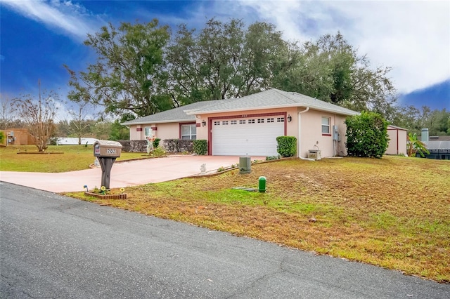 ranch-style house with a garage and a front lawn