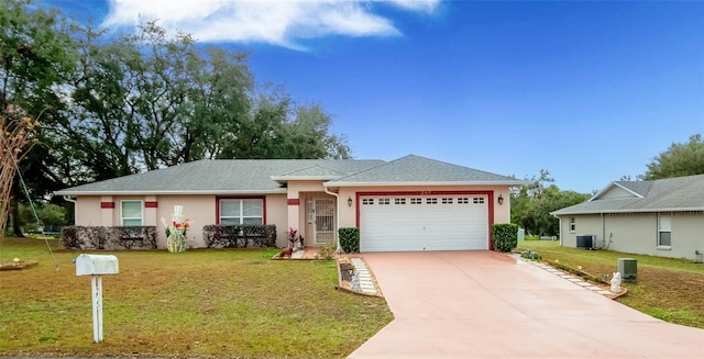 ranch-style house featuring cooling unit, a front yard, and a garage