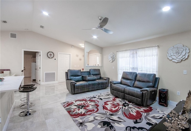 living room featuring ceiling fan and lofted ceiling