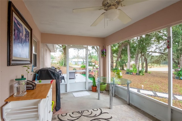 sunroom / solarium with ceiling fan and a wealth of natural light