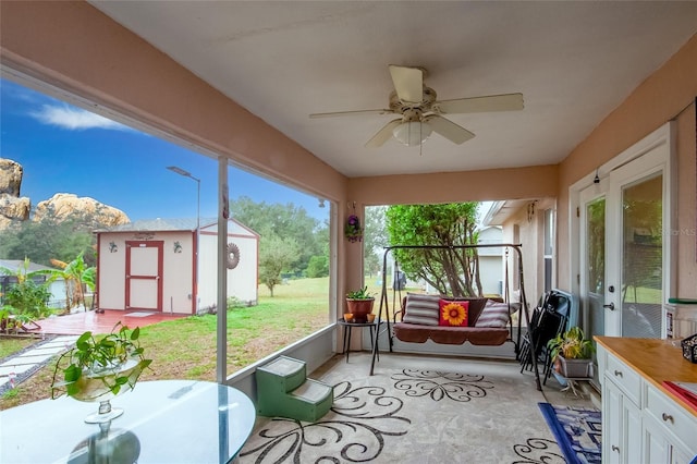 sunroom with ceiling fan and a healthy amount of sunlight