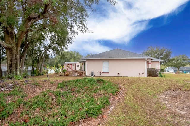 view of home's exterior featuring a yard