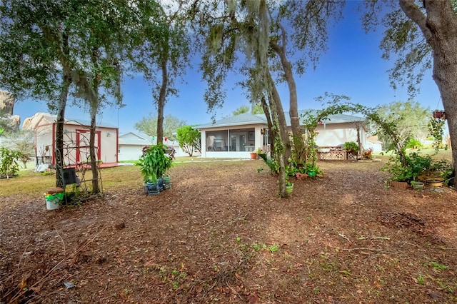 view of yard featuring a sunroom