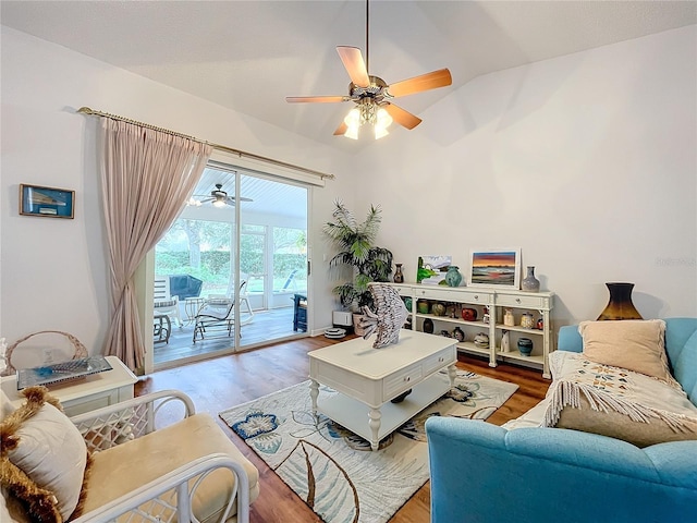 living room with lofted ceiling, ceiling fan, and wood-type flooring